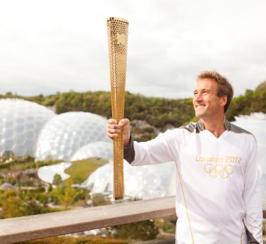 Ben Fogle holding the Olympic Flame at the Eden Project